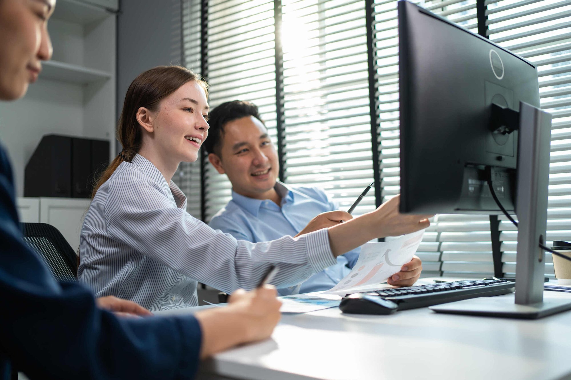 HR team working together on computer