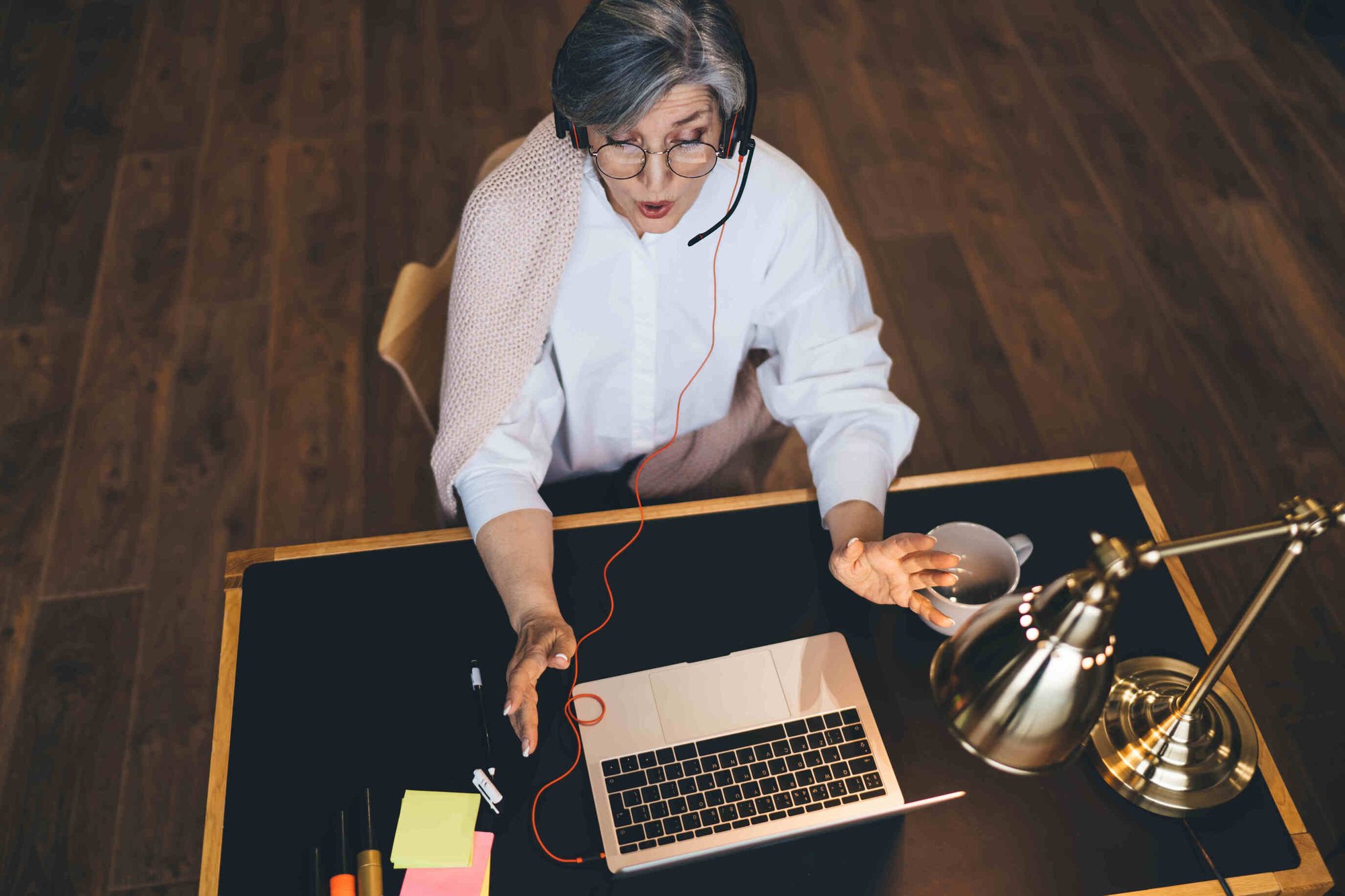 Woman on a laptop call assisting with compliance questions