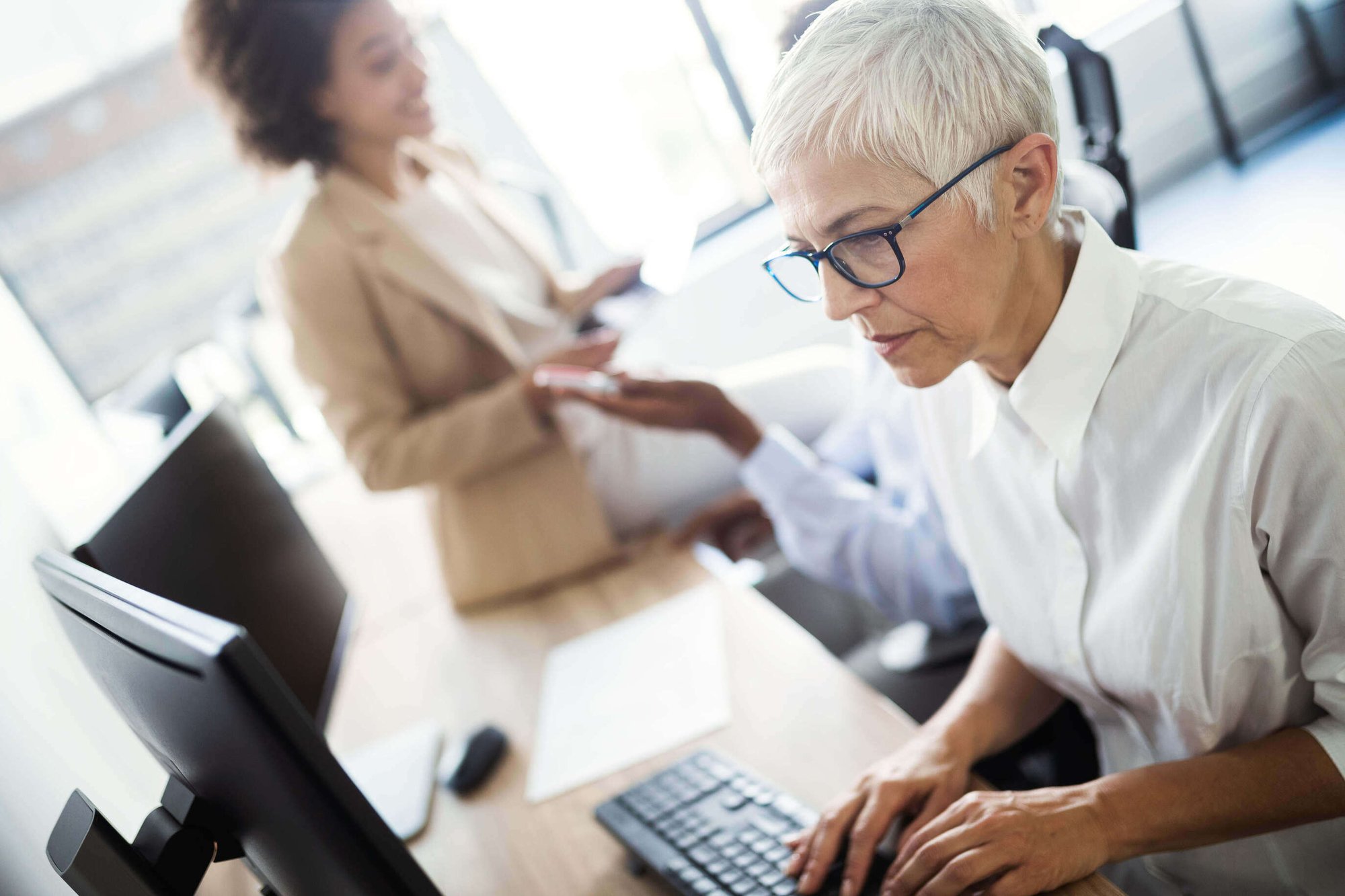 Worker on a computer looking at screen