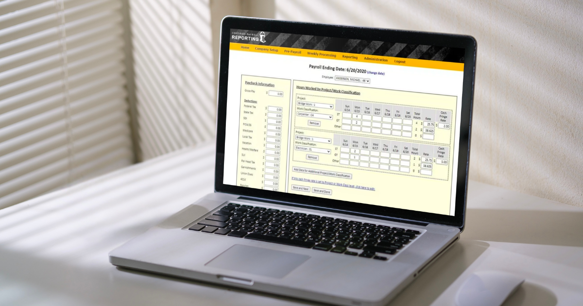 certified payroll reporting software solution on a laptop screen in a white office