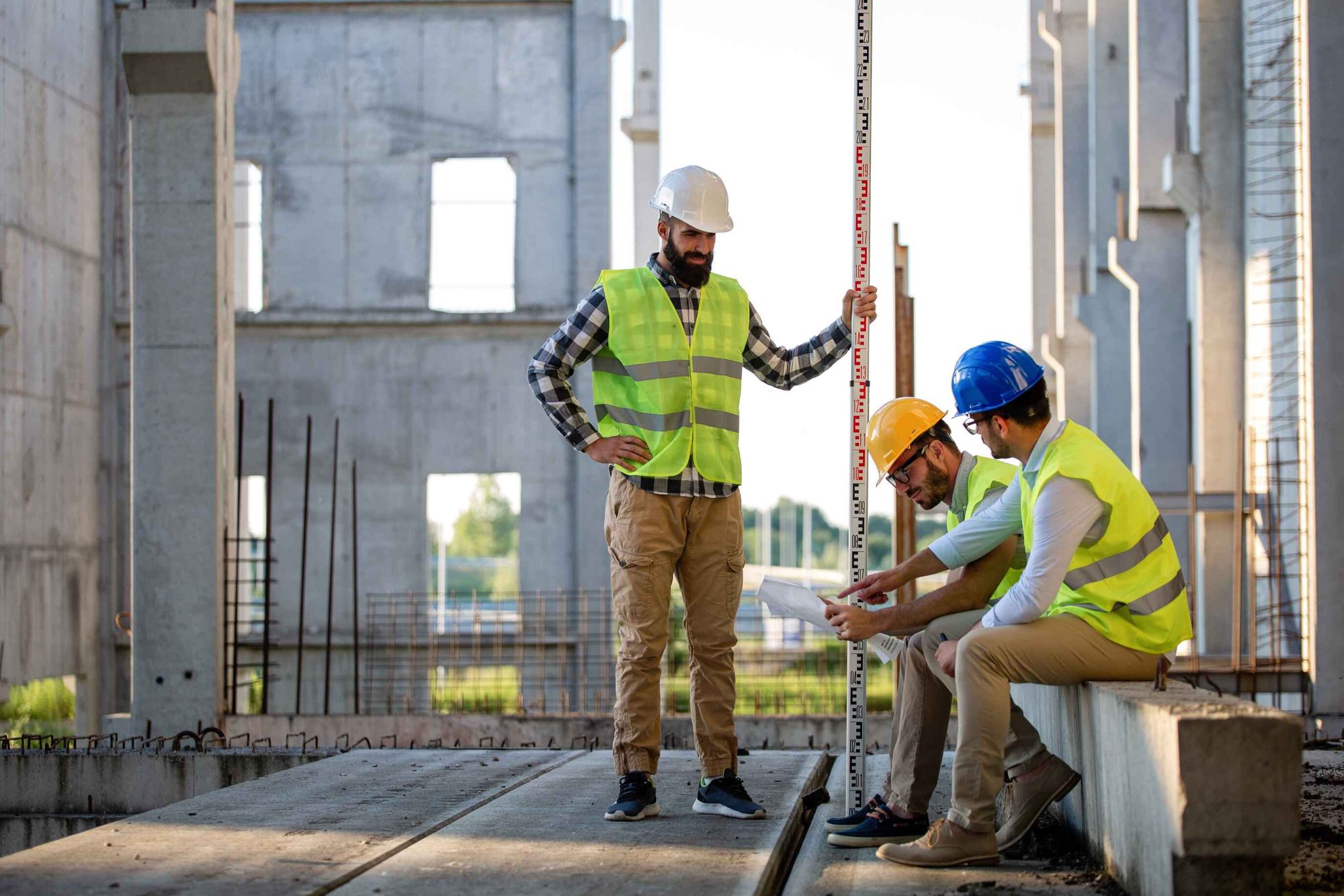Three construction workers on a government project