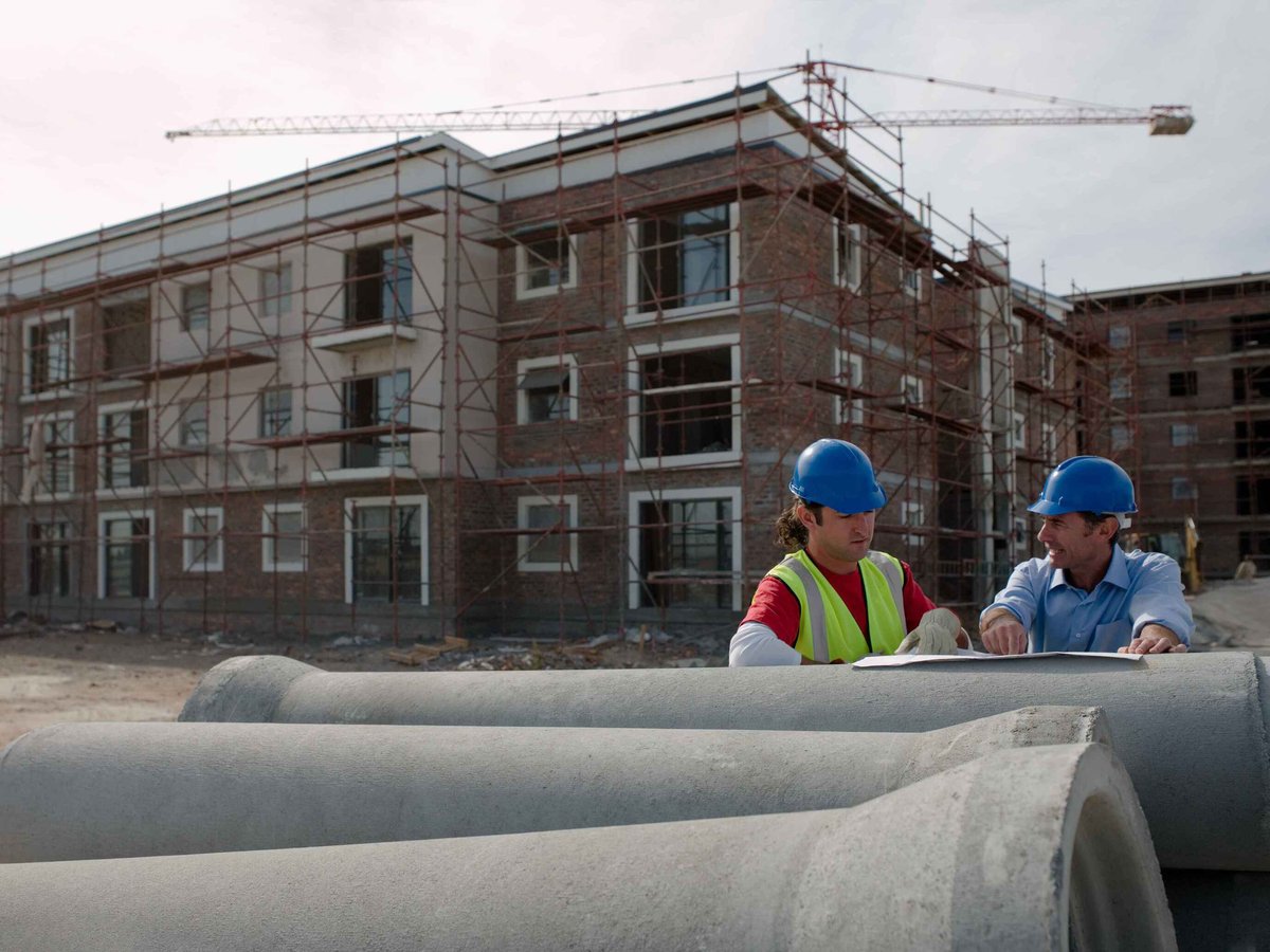 Two engineers working on a job site