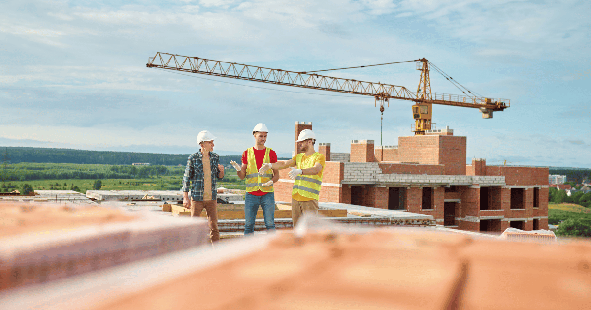 three construction workers on site three construction workers on site