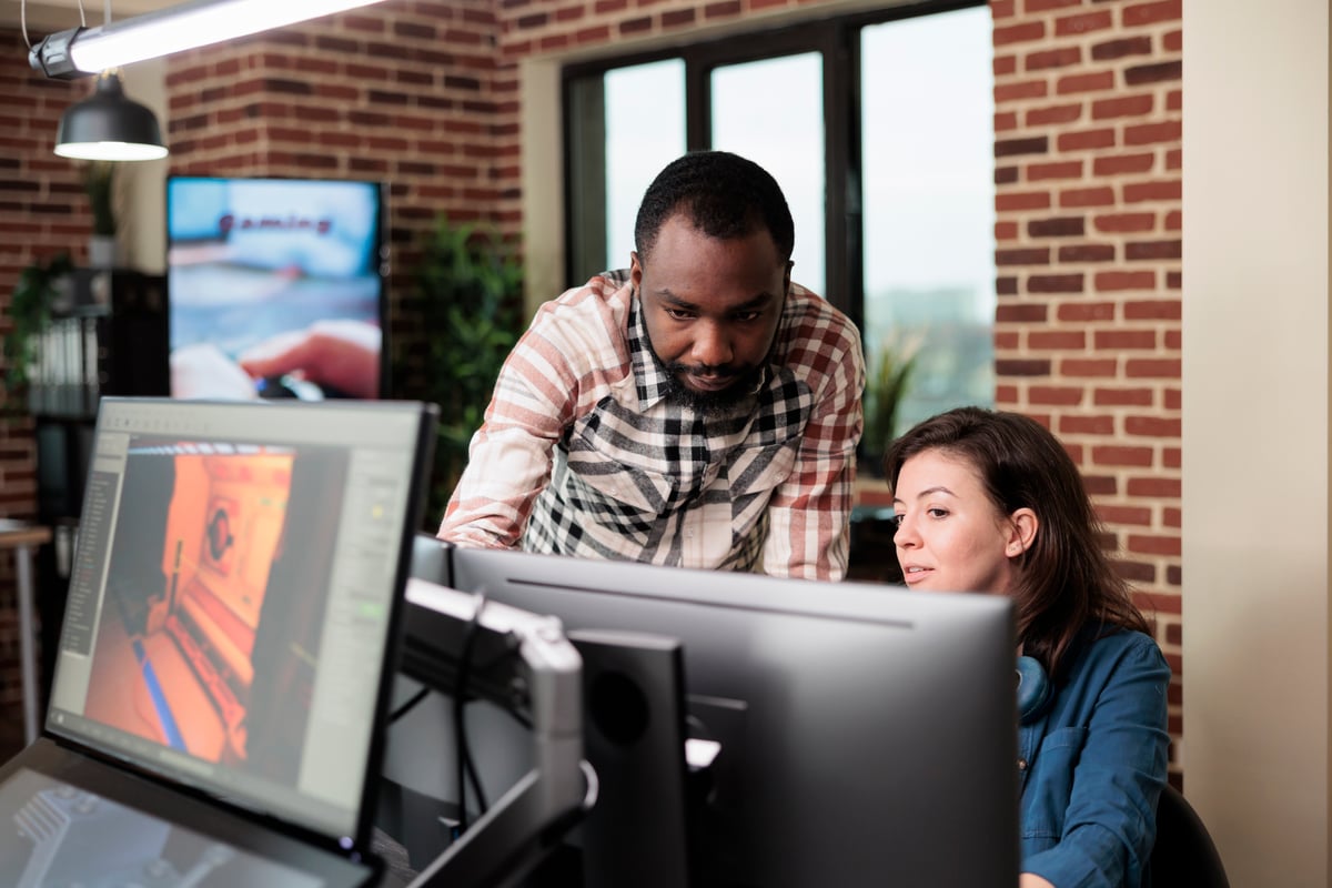 Coworkers looking at payroll reports