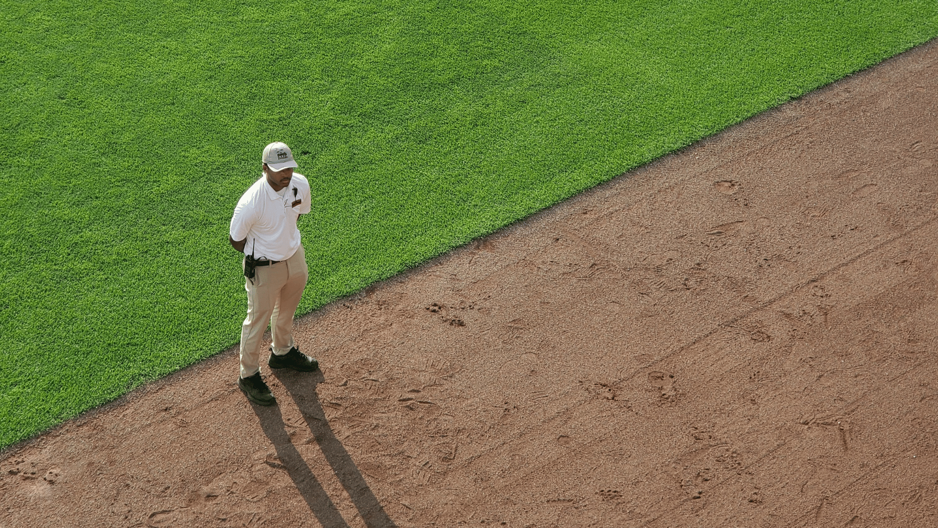 worker on baseball field