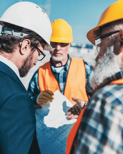 union workers meeting on site looking at plans