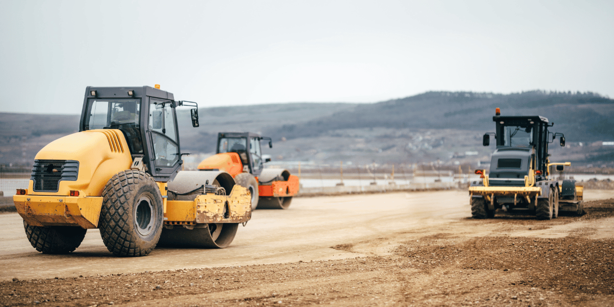 Construction equipment working on road construction Construction equipment working on road construction