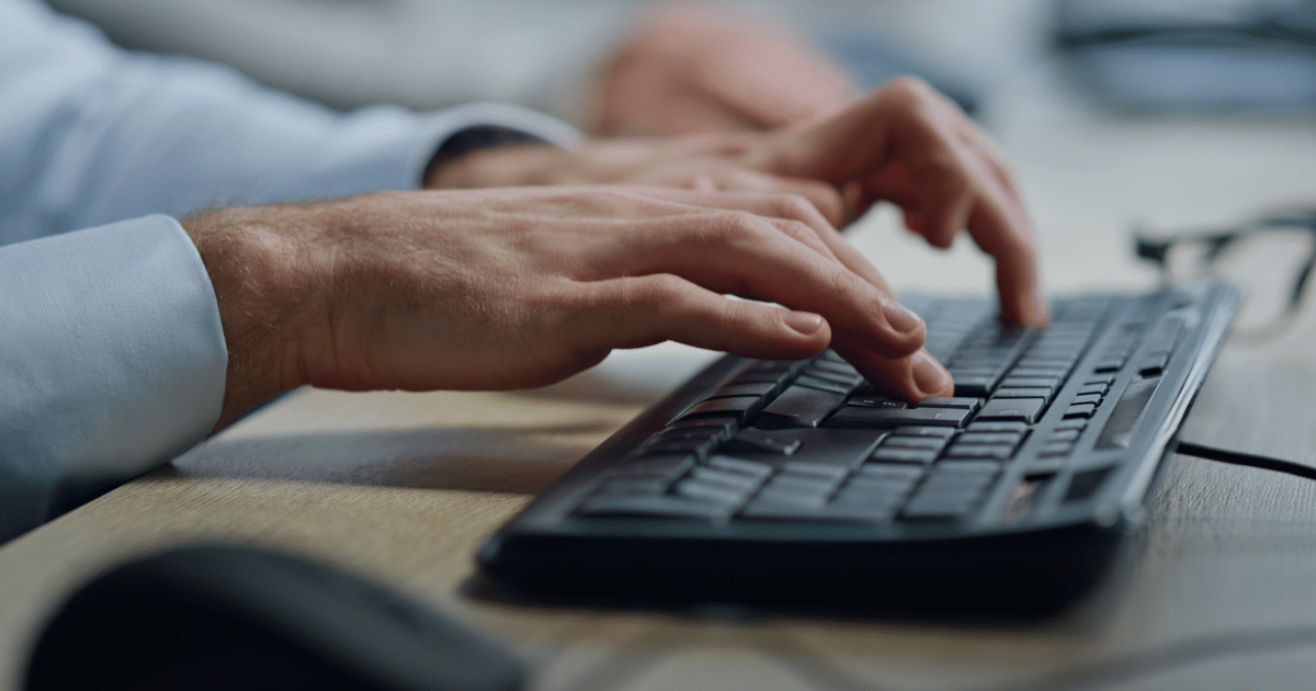 HR professional typing on keyboard. HR professional typing on keyboard.