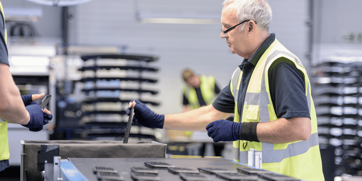 man working in an automotive manufacturing plant