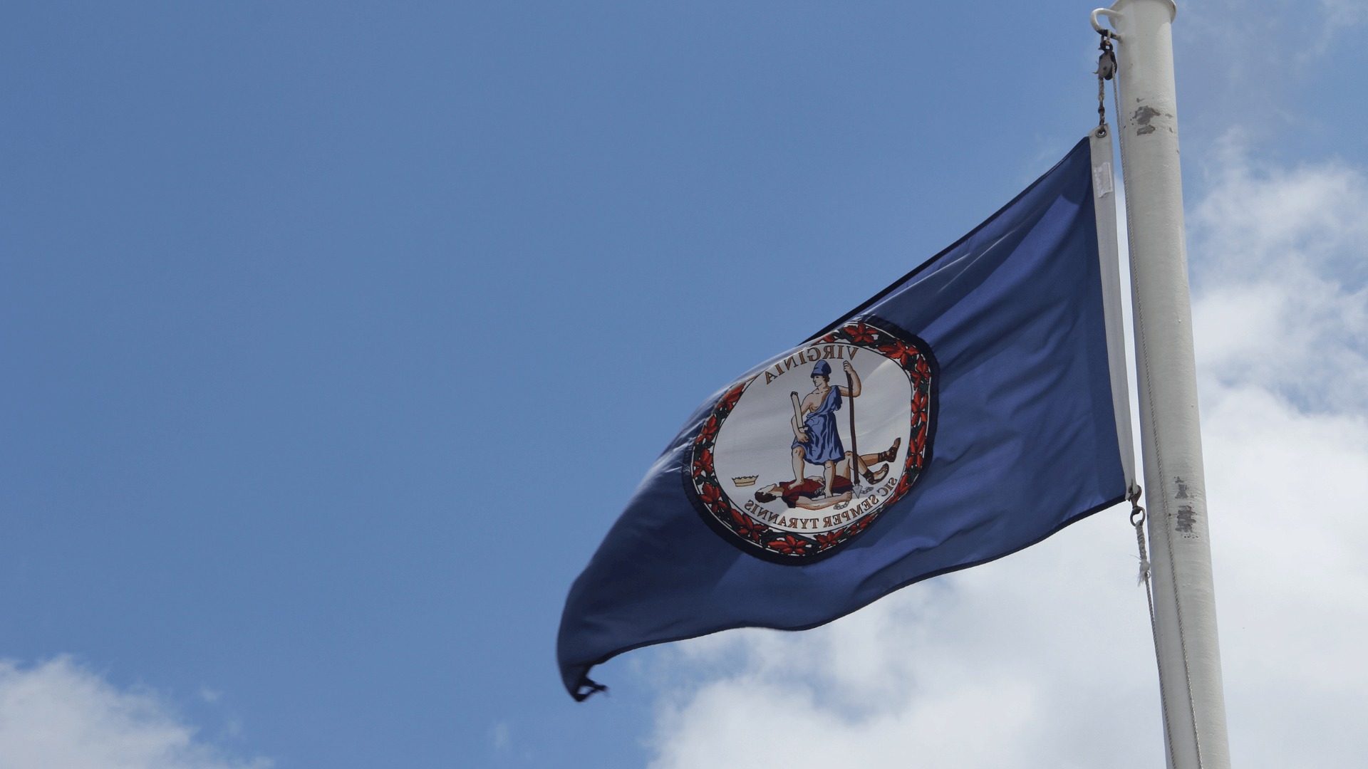 Virginia state flag waving in the sky