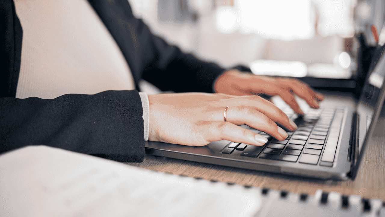 Woman typing on keyboard